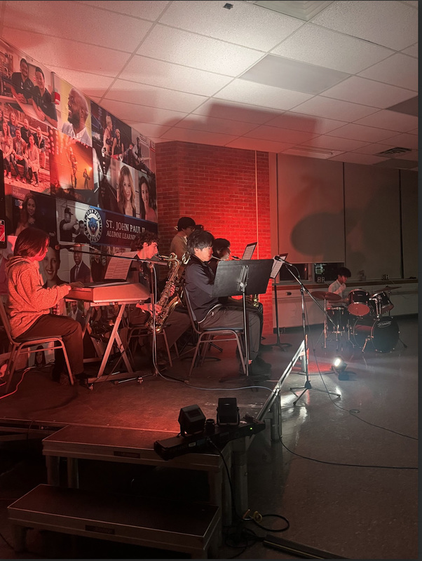 Photo of St. John Paul II students performing at the Coffeehouse