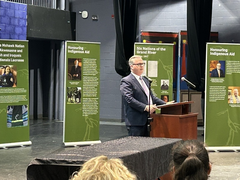 Photo of Director Brendan Browne speaking during the event at the podium