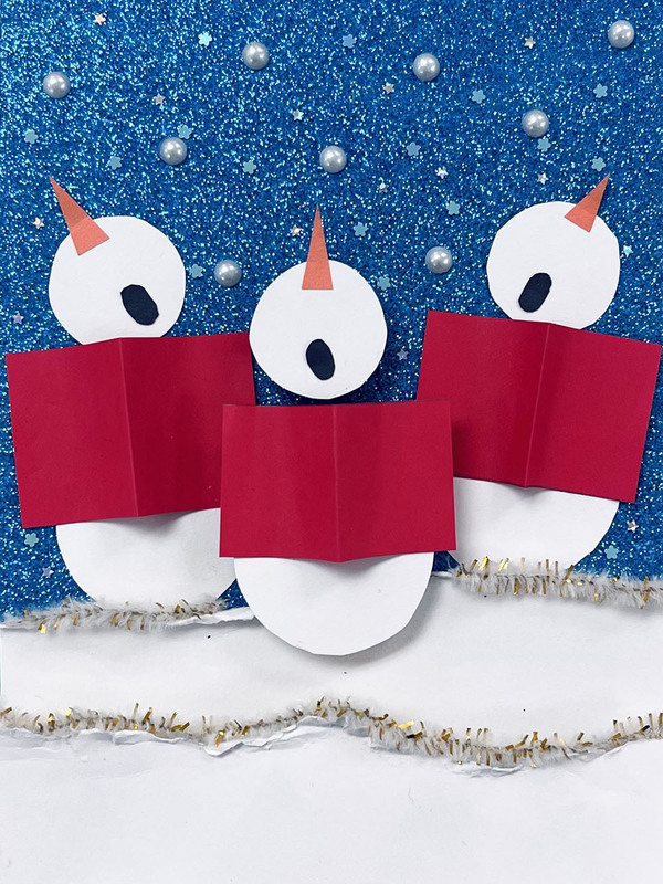 Christmas card designed by Francis Libermann student, showing three snowmen caroling
