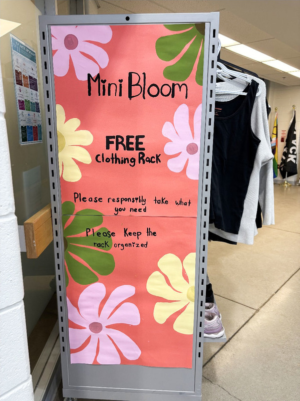 Photo of the Mini Bloom Clothing Rack full of donated clothing items