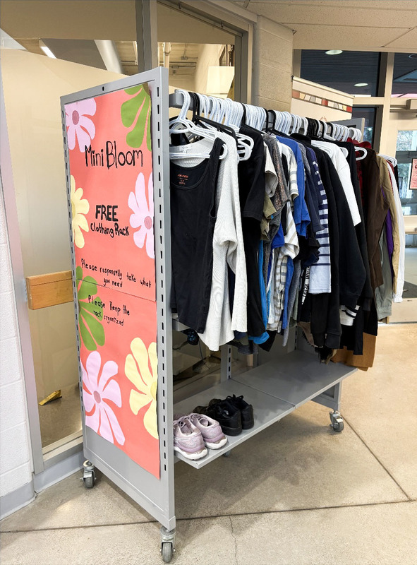 Photo of the Mini Bloom Clothing Rack full of donated clothing items