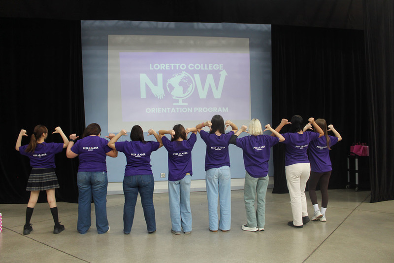 Group photo of Loretto College School ELL peer leader students wearing shirts that say Peer Leader on the back