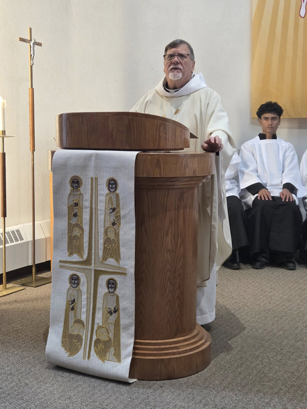 Photo of Chaplain speaking at the podium
