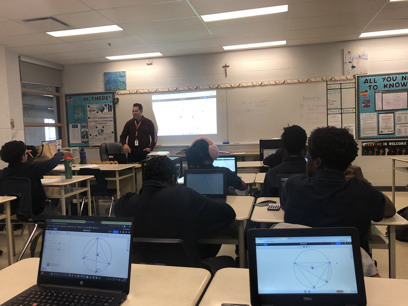 Photo of Father Henry Carr students working on the sessions in math class