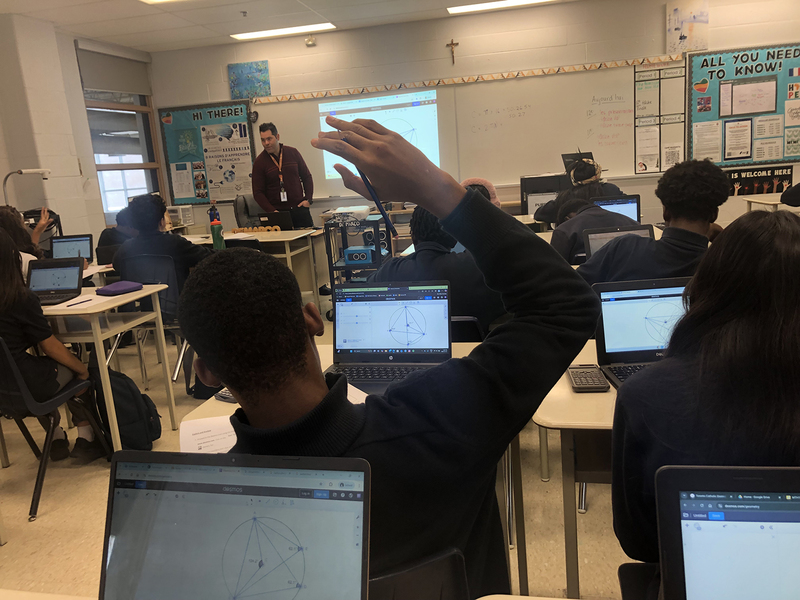 Photo of Father Henry Carr students working on the sessions in math class