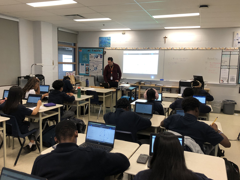 Photo of Father Henry Carr students working on the sessions in math class