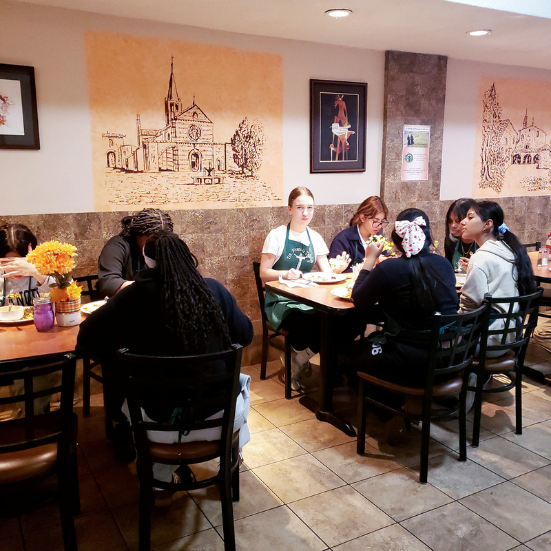 Photo of Loretto College students working at St. Francis Table