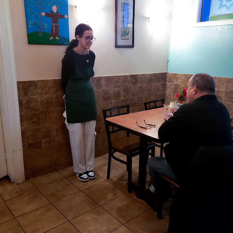 Photo of Loretto College students working at St. Francis Table