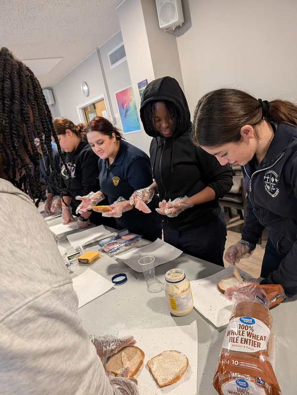 Loretto College Students Prepare Food to Be Distributed to Homeless as Part of A.C.C.T.S. Day