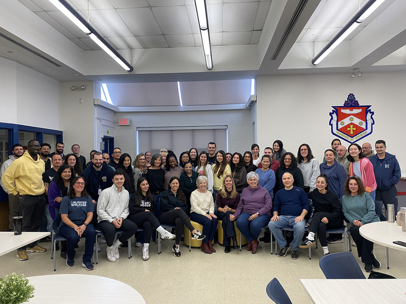 Group photo of Father Henry Carr staff