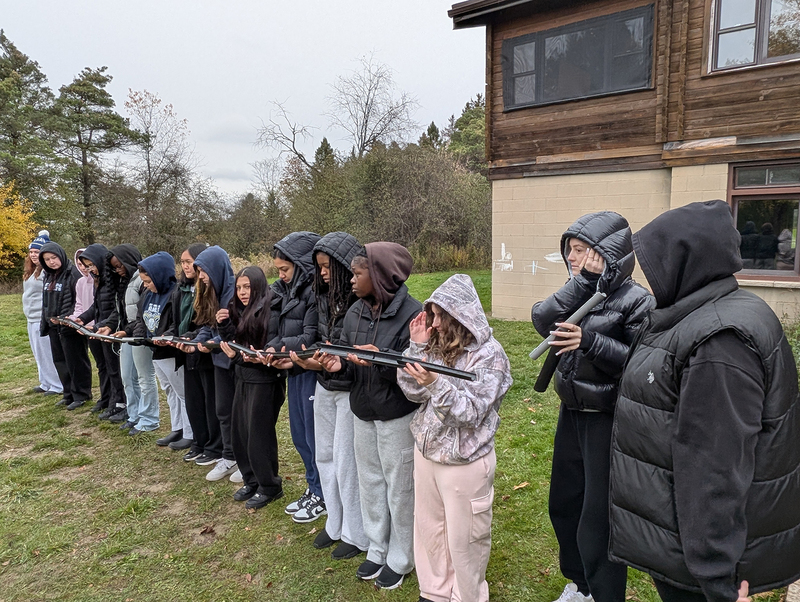 Photo of Loretto College students working together on a challenge