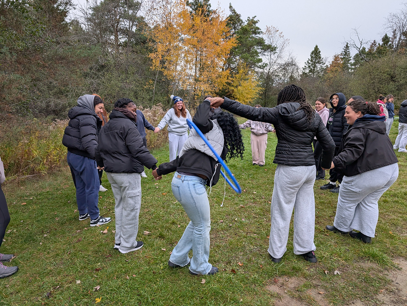Photo of Loretto College students working together on a challenge