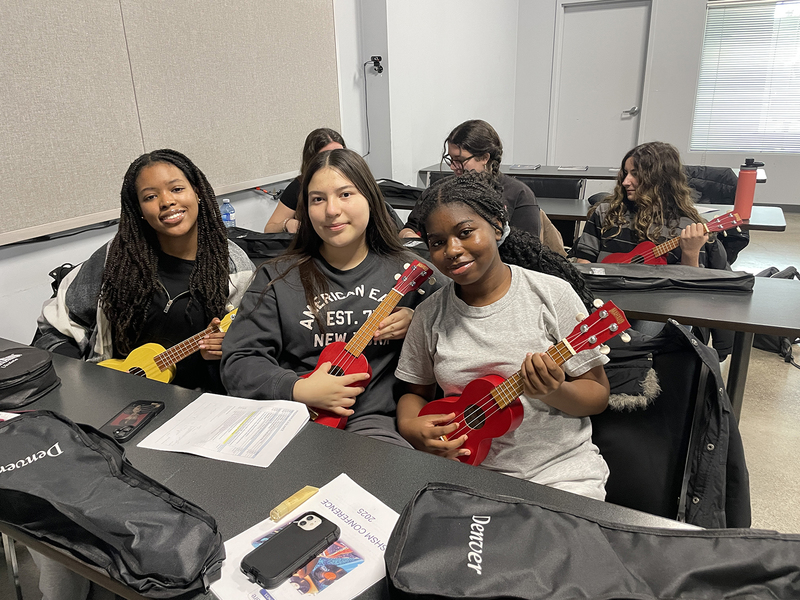 Photo of Loretto College students playing ukulele at the Music Care Conference