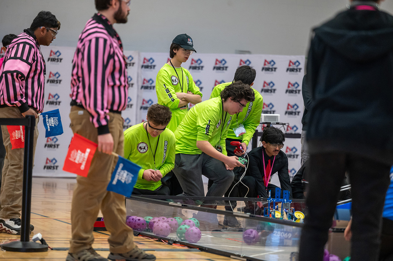 Photo of 18846 Brebotics team working on their robotics project for the tournament