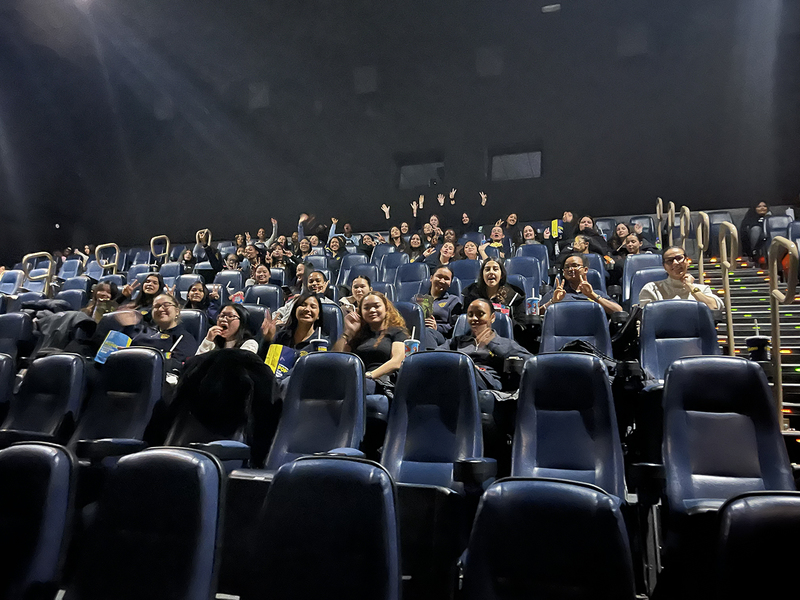 Photo of Loretto College students and staff in their seats before the Wicked: For Good screening
