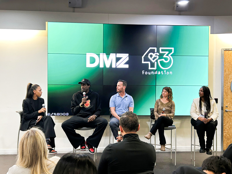 Photo of Principal Lorraine Van Zon of Bishop Macdonell Catholic Elementary School on stage with former Toronto Raptor and NBA All-Star Pascal Siakam, Dakota Whyte — Executive Director of the PS43 Foundation, James Hayes of Cyber Legends, and Erica Derrickson of English Islands at an exclusive event hosted at Toronto Metropolitan University’s DMZ