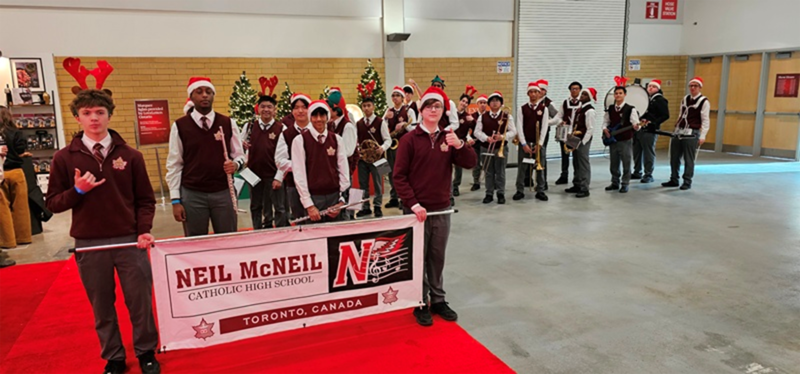 Photo of Neil McNeil Marching Band students performing at the show