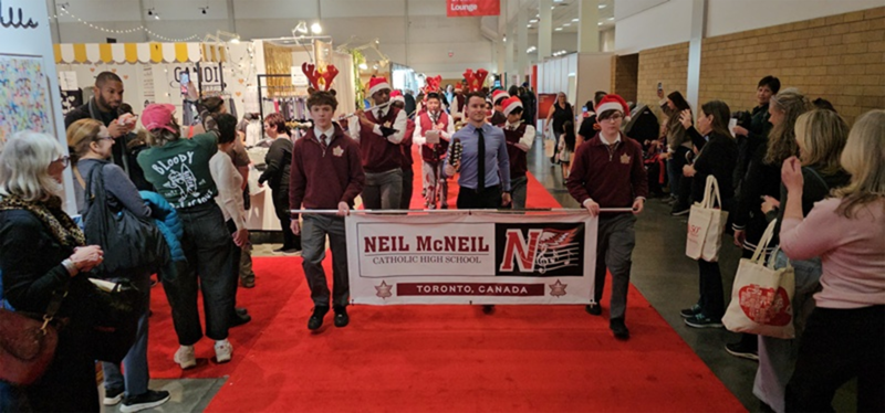 Photo of Neil McNeil Marching Band students performing at the show