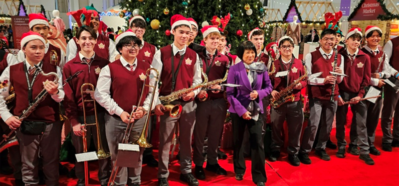 Group photo of Neil McNeil Marching Band students with Mayor Olivia Chow