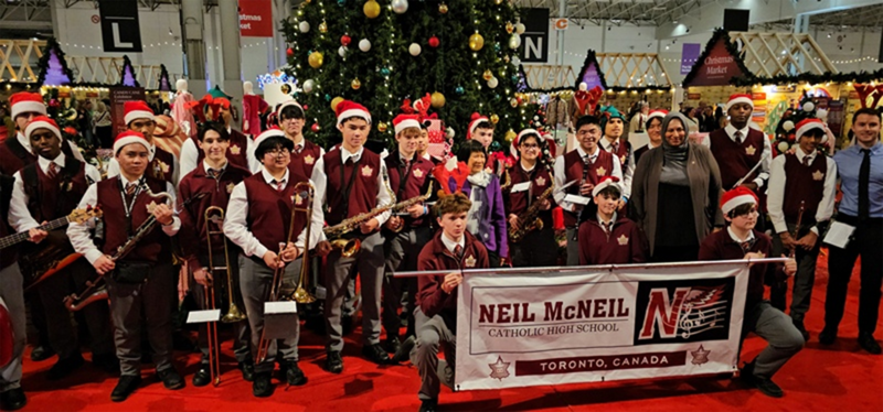 Photo of Neil McNeil Marching Band students performing at the show