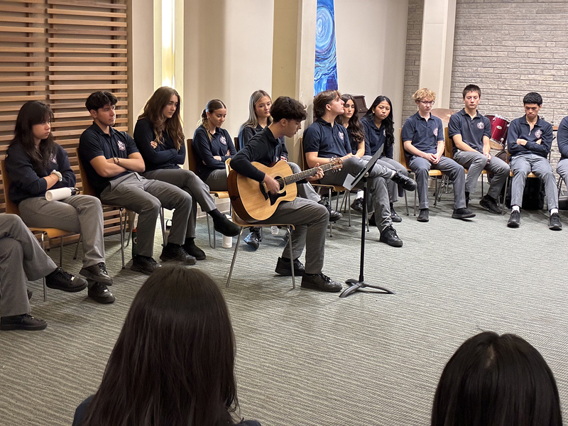 Photo of Father John Redmond students listening and playing music during the session