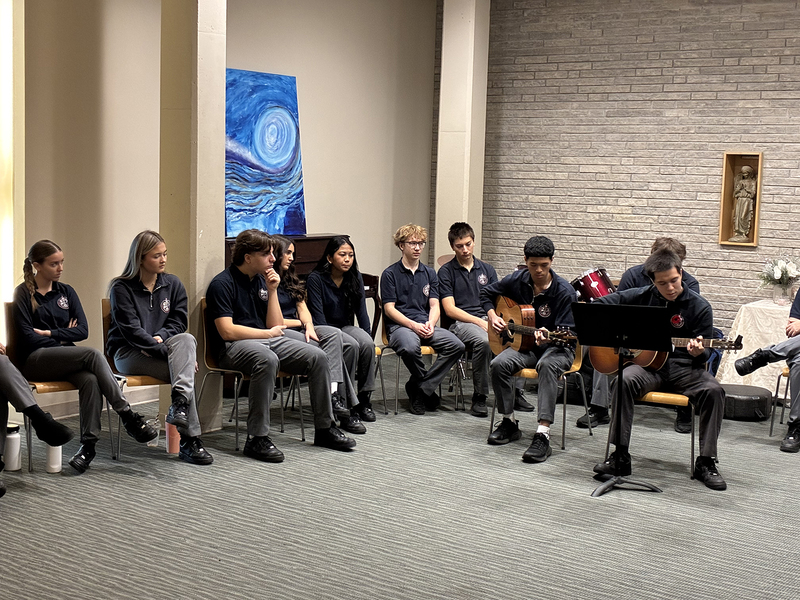 Photo of Father John Redmond students listening and playing music during the session