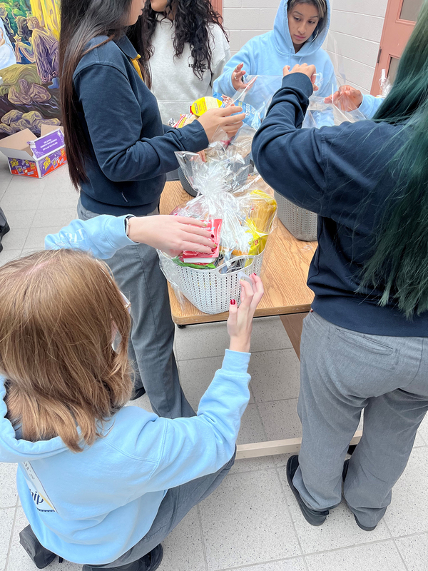 Photo of St. Basil-the-Great College School's leadership students organizing the food that they collected for the drive