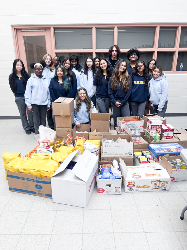 Group photo of St. Basil-the-Great College School's leadership students with the boxes of food that they collected for the drive