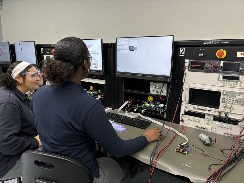 Photo of two SJOA students exploring Health and Wellness technology at Seneca