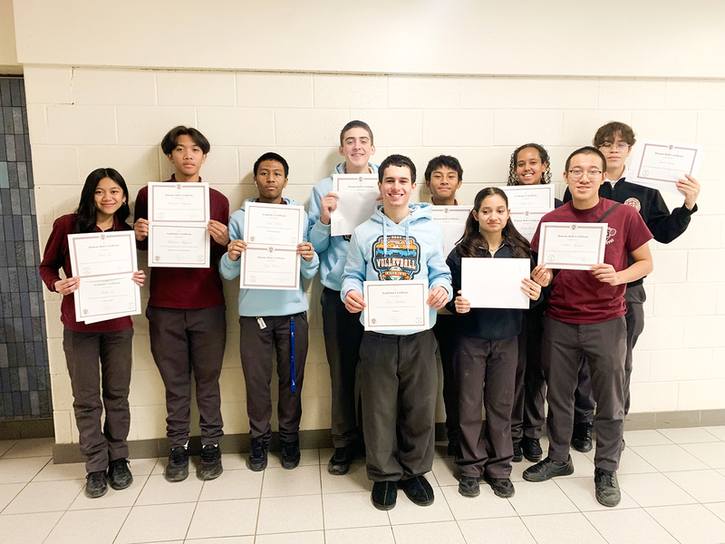 Group photo of St. Oscar Romero students with their achievement certificates