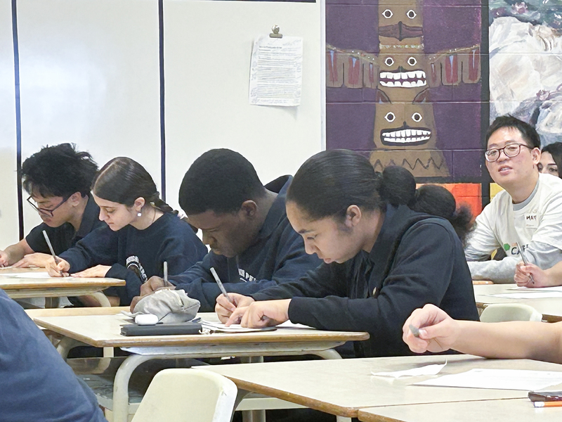 Photo of students working in class under the direction of the career coaches