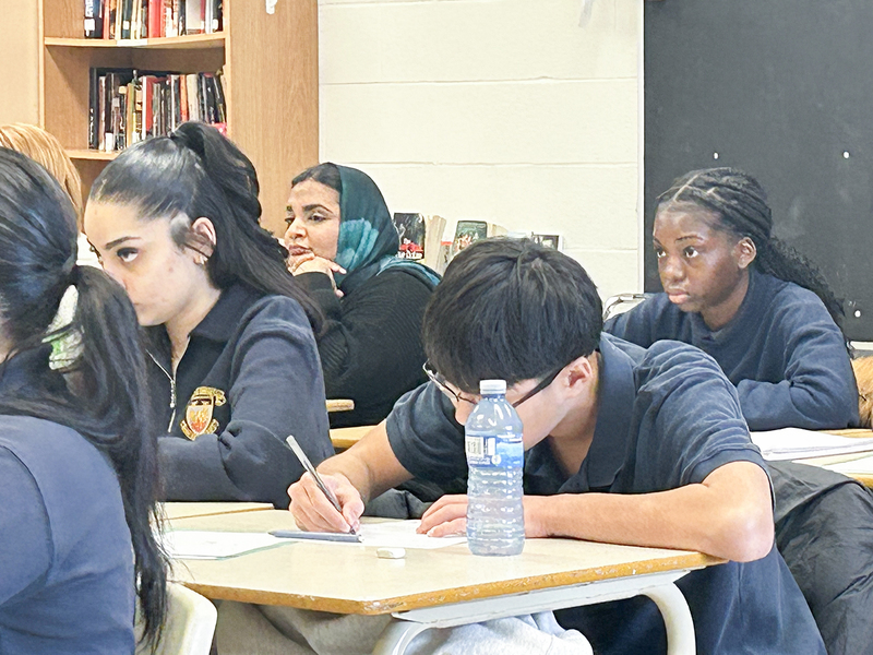 Photo of students working in class under the direction of the career coaches