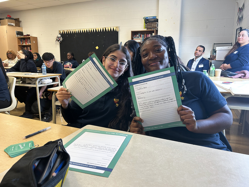 Photo of students working in class under the direction of the career coaches