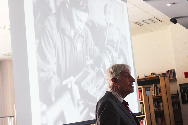 Photo of Elly speaking to St. Oscar Romero students
