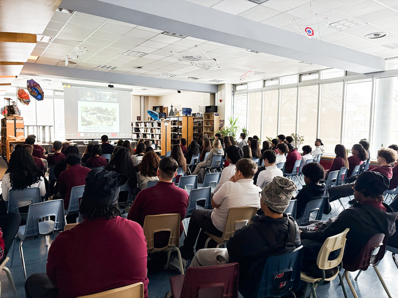 Photo of St. Oscar Romero students listening to Elly