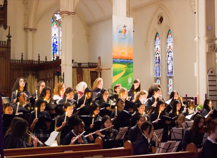 Photo of SJCS students performing in the Church