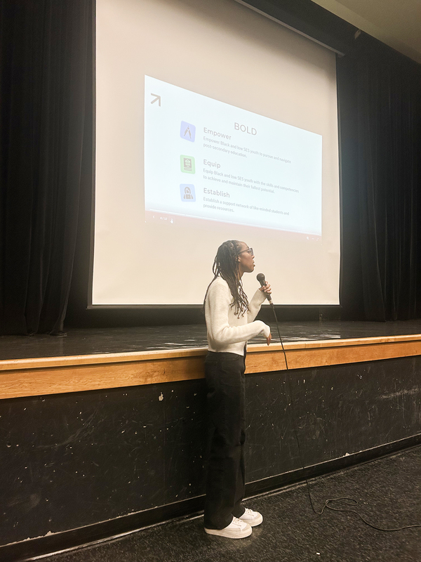 Photo of speakers presenting during the event