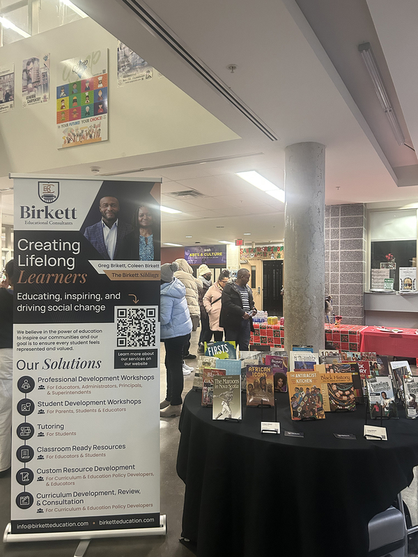 Photo of attendees browsing the various information tables at the event