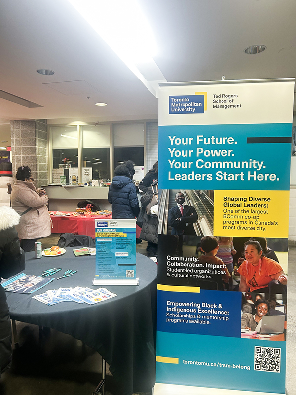 Photo of attendees browsing the various information tables at the event