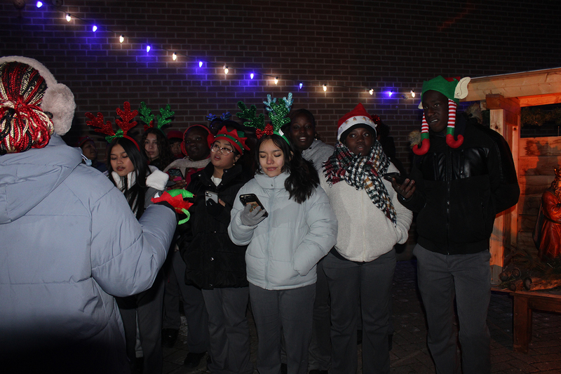 Photo of attendees at Father Henry Carr's Christmas in the Courtyard celebration