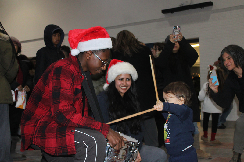 Photo of attendees at Father Henry Carr's Christmas in the Courtyard celebration