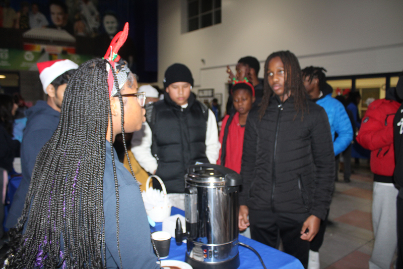 Photo of attendees at Father Henry Carr's Christmas in the Courtyard celebration
