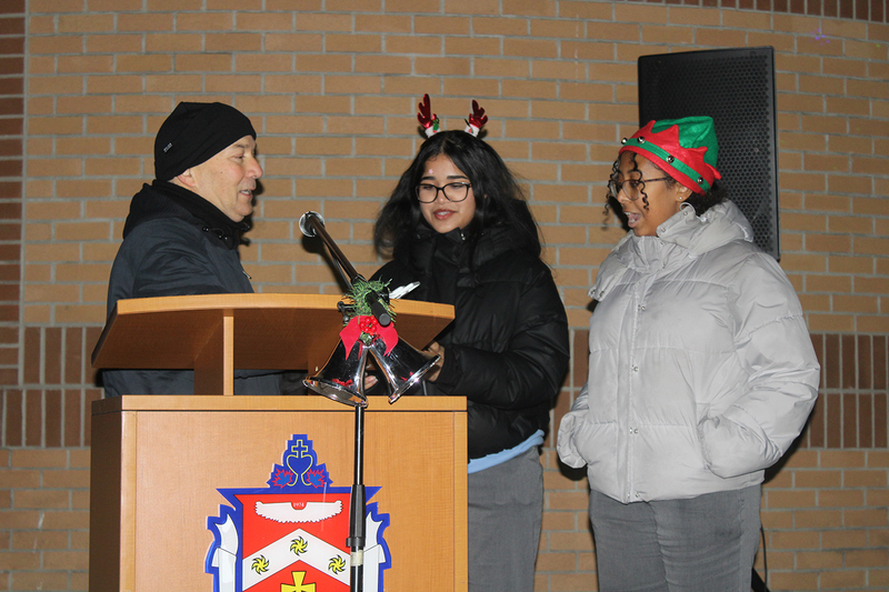 Photo of attendees at Father Henry Carr's Christmas in the Courtyard celebration