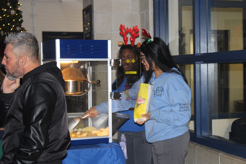Photo of attendees at Father Henry Carr's Christmas in the Courtyard celebration