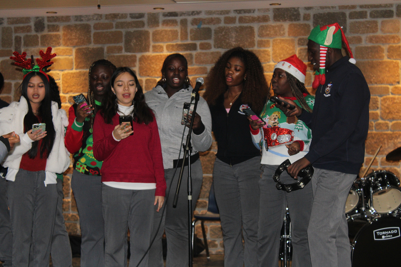 Photo of attendees at Father Henry Carr's Christmas in the Courtyard celebration
