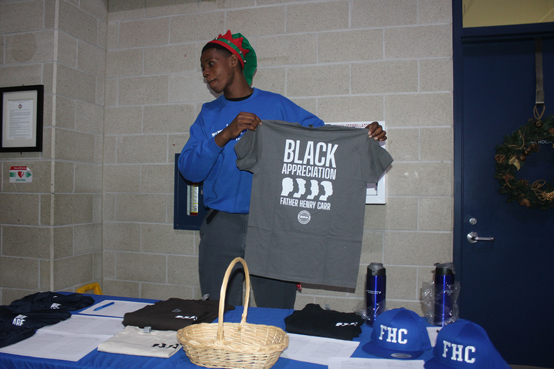 Photo of attendees at Father Henry Carr's Christmas in the Courtyard celebration