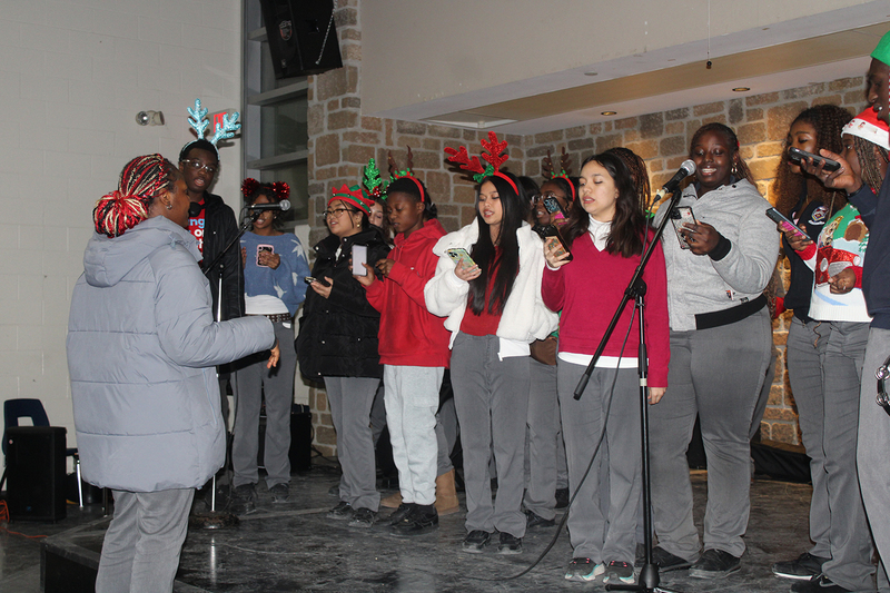 Photo of attendees at Father Henry Carr's Christmas in the Courtyard celebration