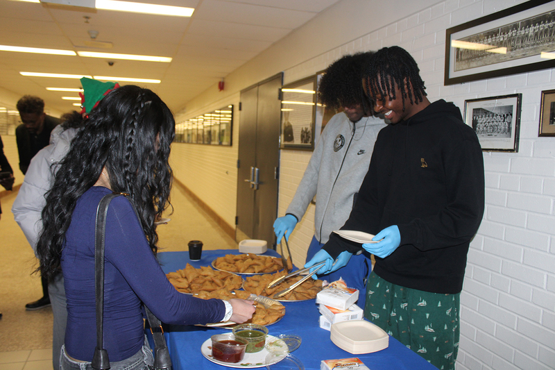 Photo of attendees at Father Henry Carr's Christmas in the Courtyard celebration