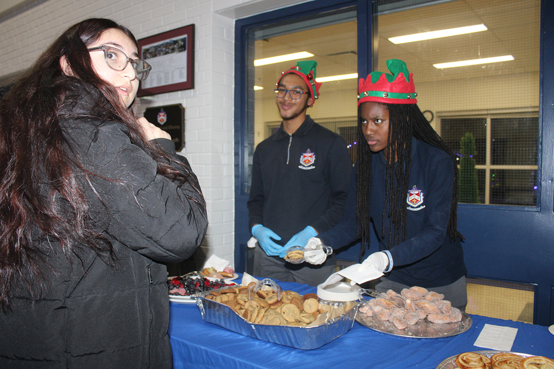 Photo of attendees at Father Henry Carr's Christmas in the Courtyard celebration