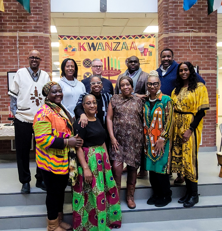 Group photo of staff in traditional attire